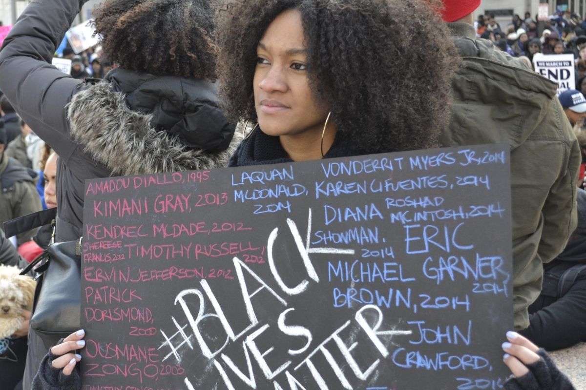 African American female holding Black Lives Matter sign