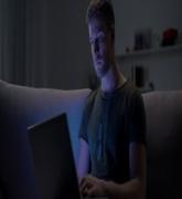 Serviceman searching job on laptop at home