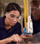 Young woman doing woodwork, Young Apprentice